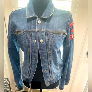 Designer Juicy Couture label jean jacket with back buttons for a fitted look.